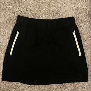 Black and white mini skort with zipper pockets and elastic waistband.  #vintage